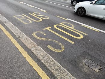 High angle view of arrow sign on road