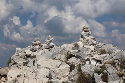 Low angle view of statue against rock formation