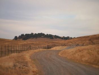 Road passing through field