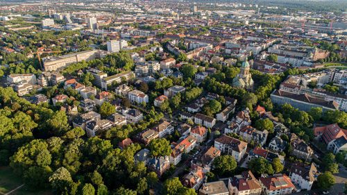 High angle view of trees and buildings in town