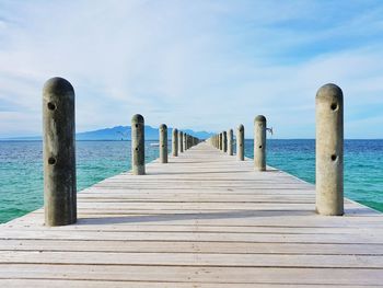 Pier over sea against sky