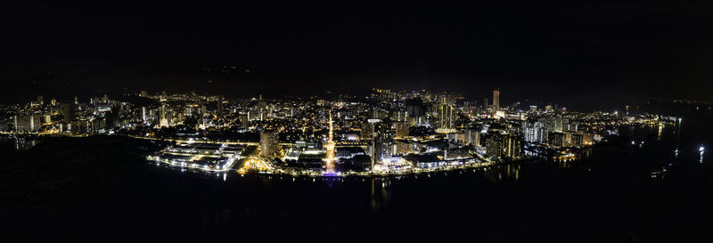 High angle view of illuminated city buildings at night