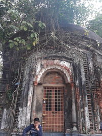 Low angle view of man against building