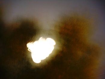 Close-up of illuminated moon against sky at night