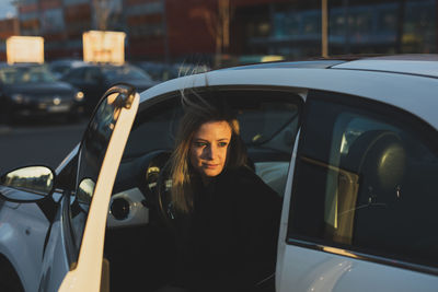 Side view of woman in car