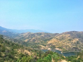 Scenic view of mountains against clear blue sky