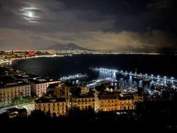 High angle view of illuminated buildings in city at night