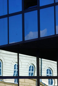 Low angle view of glass window in building