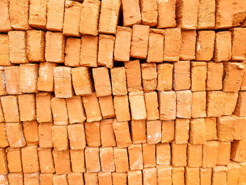 Neatly arranged red stones or bricks