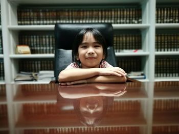 Portrait of girl on book