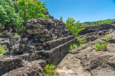 Rock formation on land against sky