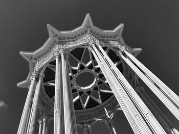 Low angle view of ferris wheel against sky at night