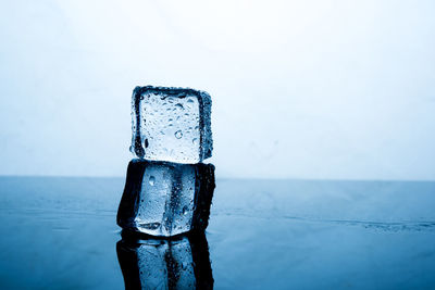 Close-up of ice cubes on table