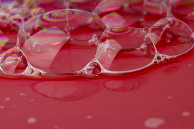 Close-up of water drops on glass table