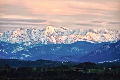 Scenic view of snowcapped mountains against sky during winter