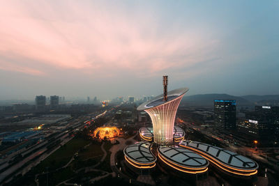 High angle view of city lit up at night
