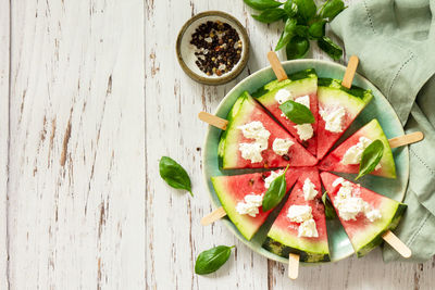 High angle view of chopped vegetables in bowl on table