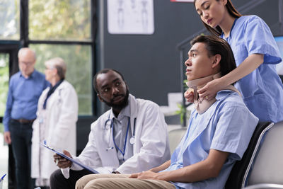 Doctor examining patient at clinic