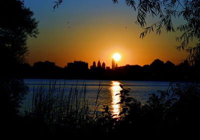 Scenic view of lake at sunset