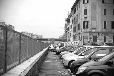 Street amidst buildings in city against sky