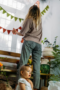 Happy woman standing at home