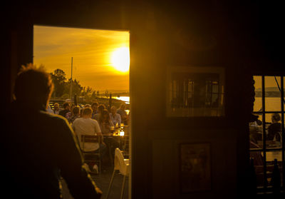 Silhouette of woman at sunset