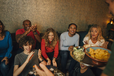 Group of people at market stall