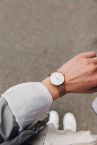 Low section of woman checking time