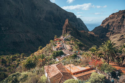 High angle view of trees and mountains against sky