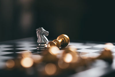 Close-up of chess pieces on table