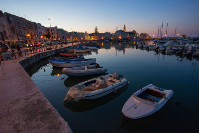 Boats moored at harbor