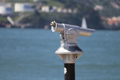 Coin-operated binoculars by sea