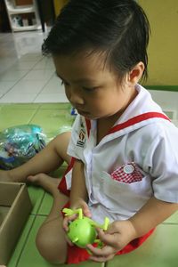 Close-up of cute baby boy at school