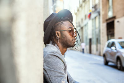 Portrait of young man looking away