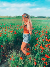 Ukrainian girl in a field with poppies, bright colors of summer