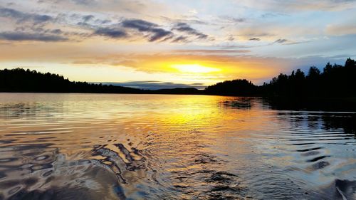 Scenic view of sunset over lake