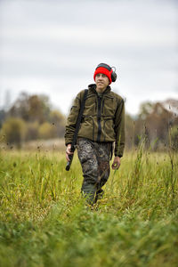 Teenage boy with rifle at hunting