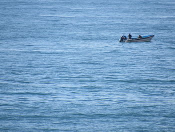 People on boat in sea