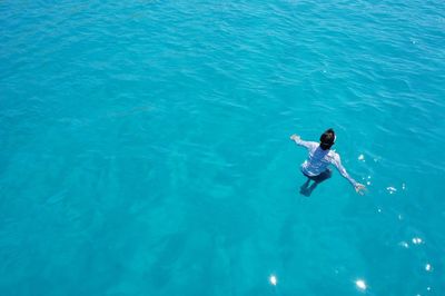 High angle view of person swimming in sea