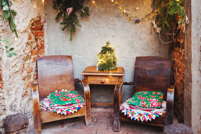Christmas family garden or front porch. rustic boho outdoor decor and old wooden table and armchairs