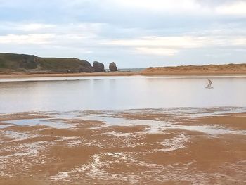Scenic view of beach against sky