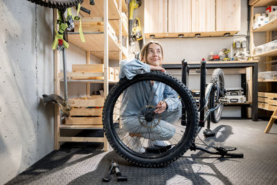 Woman sitting in bicycle