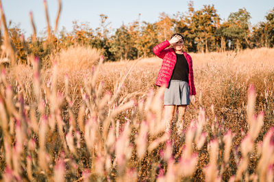 Woman standing on field