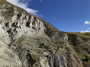 Low angle view of rock formations against sky