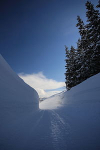 Scenic view of snow covered mountains against sky