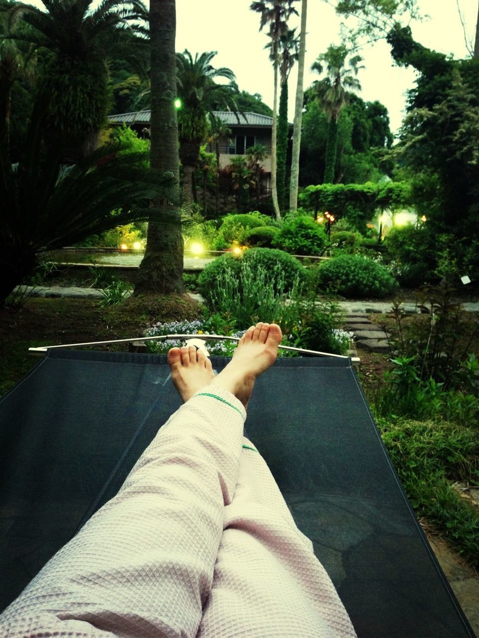 lifestyles, low section, tree, leisure activity, relaxation, person, personal perspective, sitting, barefoot, legs crossed at ankle, resting, sunlight, lying down, part of, relaxing