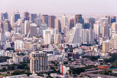 High angle view of buildings in city against sky