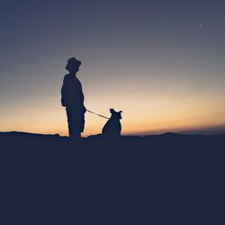 Silhouette of woman at sunset