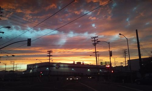 Traffic on road at sunset