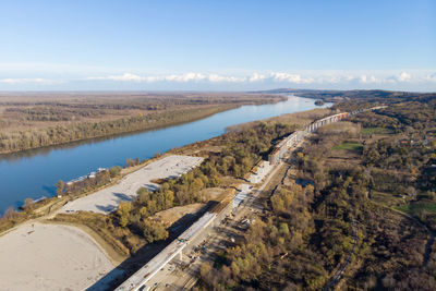 High angle view of river amidst landscape against sky